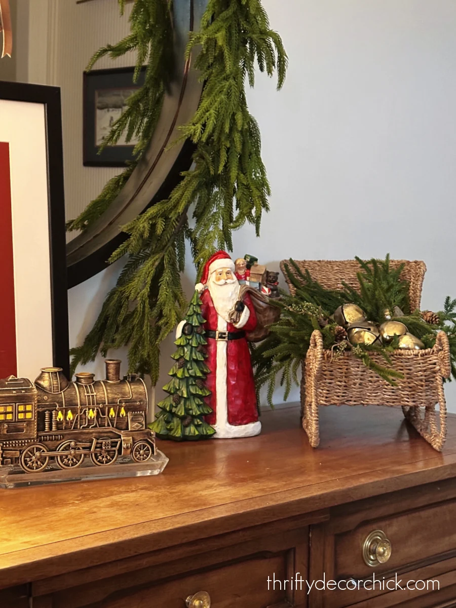Santa figurine and woven sleigh